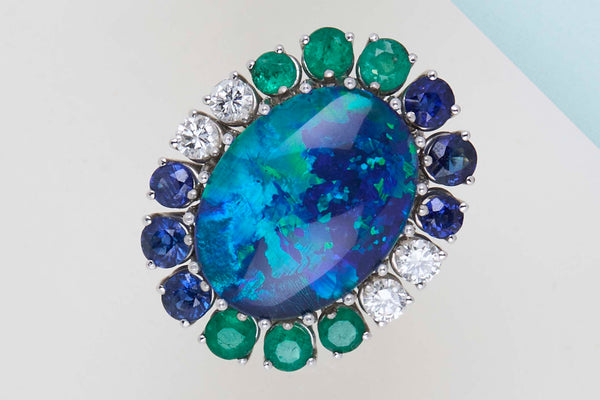 18ct. White Gold Ring - Doublet Opal - 6 Sapphires - 6 Emeralds - 4 Diamonds - Size 56