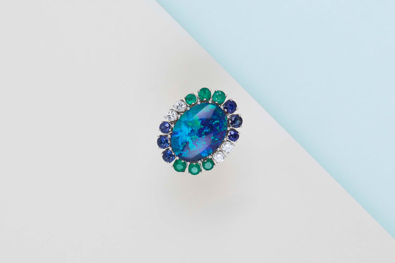 18ct. White Gold Ring - Doublet Opal - 6 Sapphires - 6 Emeralds - 4 Diamonds - Size 56