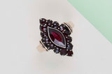 9ct. White Gold Ring - Garnet - Size 53